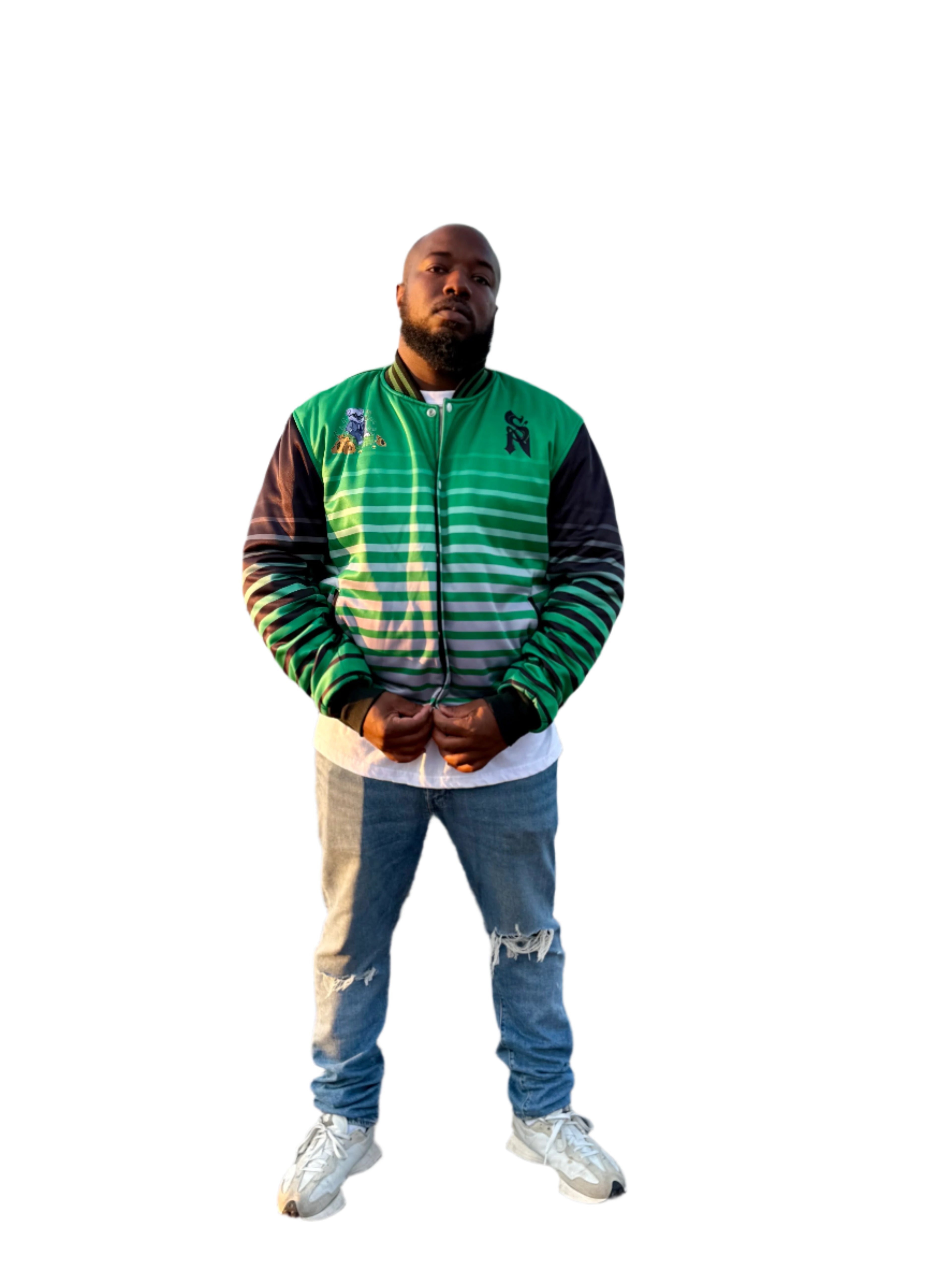Man wearing a green and black jacket standing by a waterfront